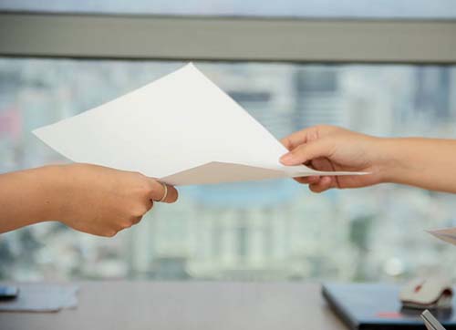person handing over paper photo – Free Image on Un.jpg